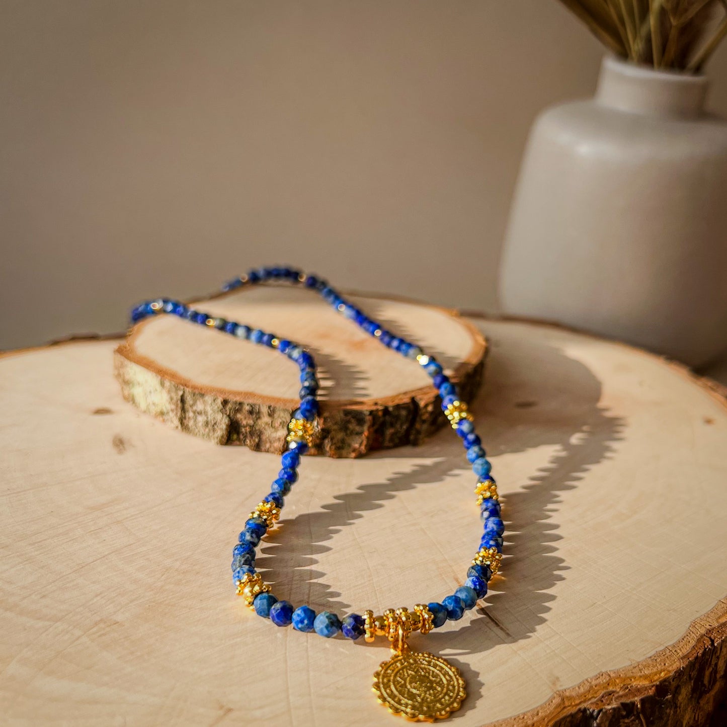 Azure - Lapis Lazuli Beaded Necklace with Ethnic round charm 17x14 mm - sun motif - Gold plated